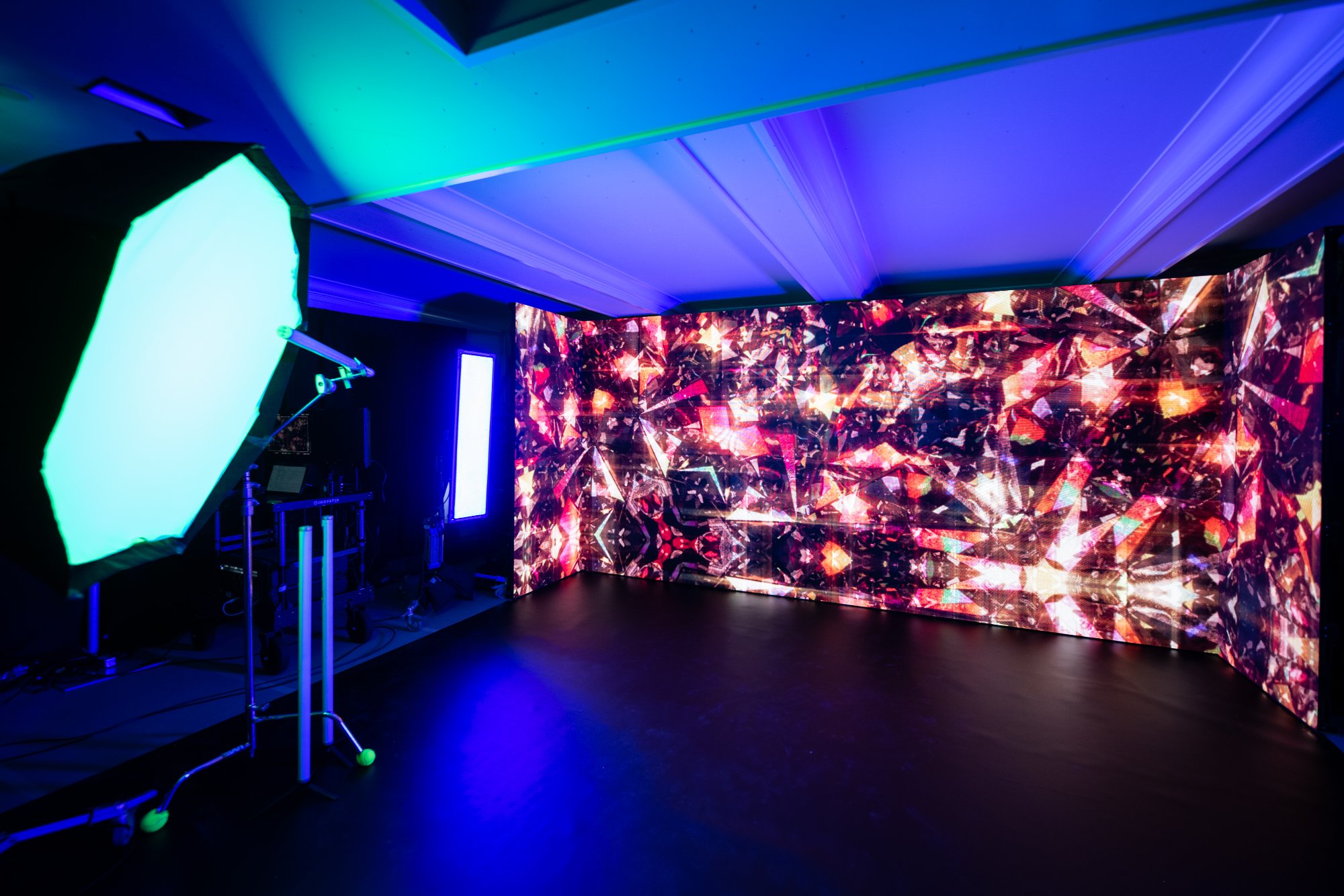 A second world inside the room, walls mapped with a diamond kaleidoscope