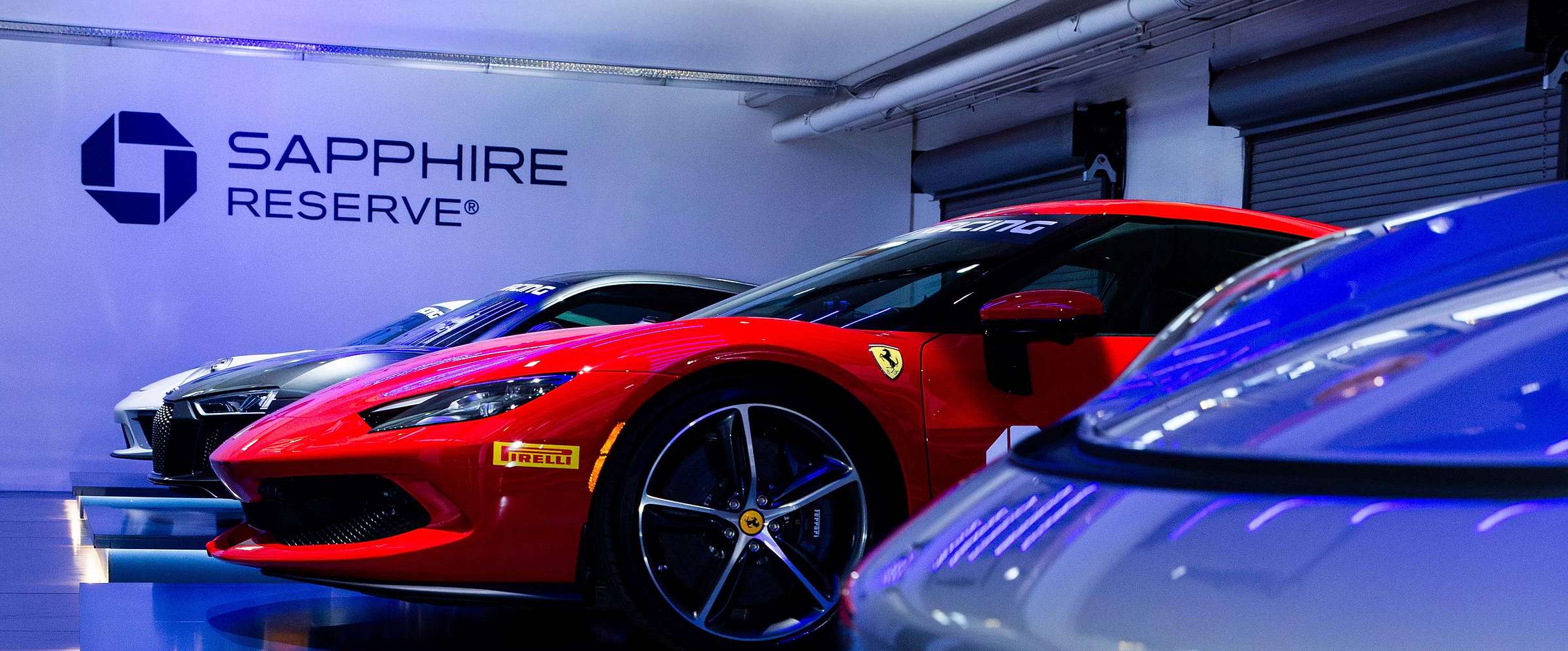 Chase Sapphire Speedway, Ferrari and supercars under brand lighting