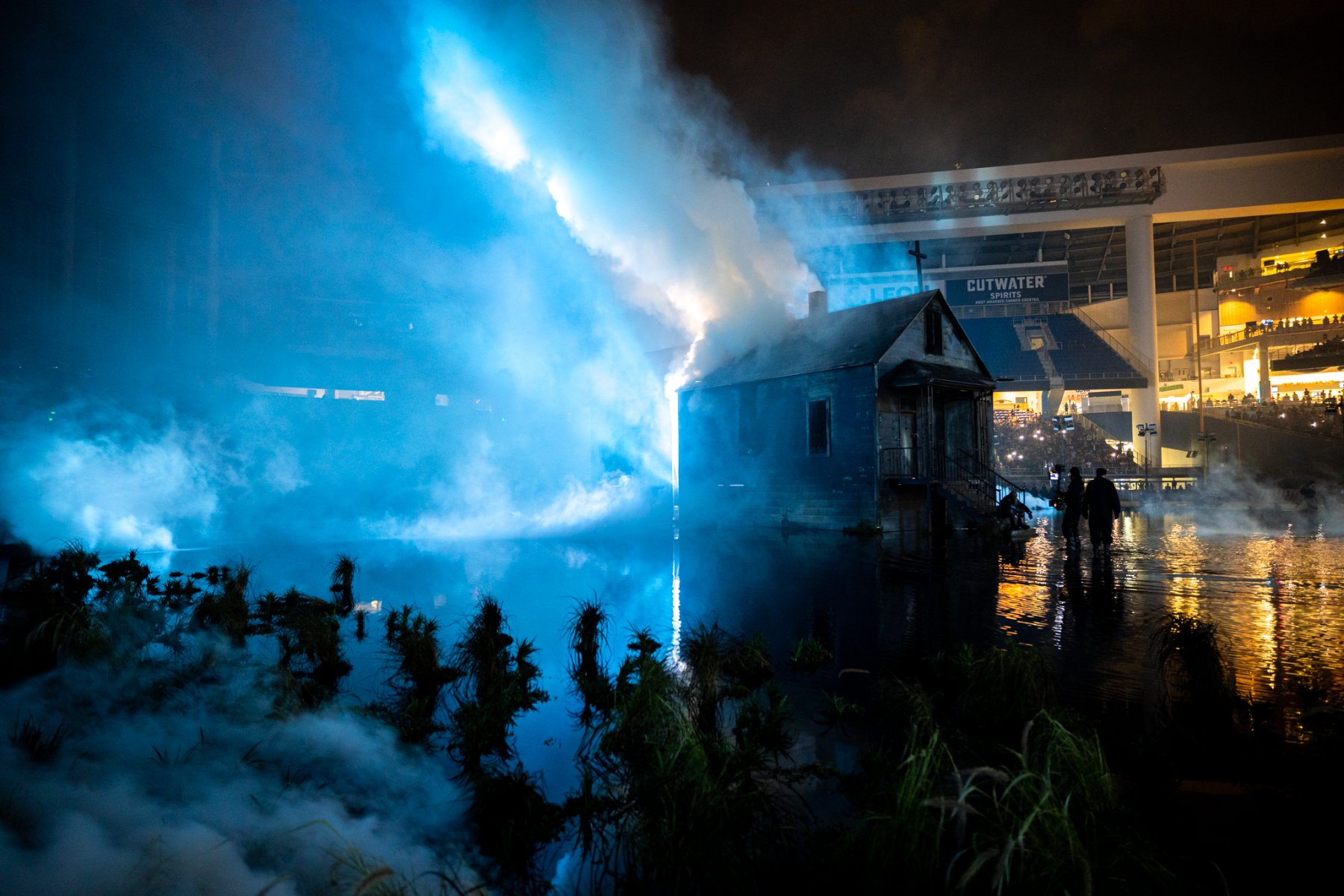 The house in blue light and smoke inside the ballpark