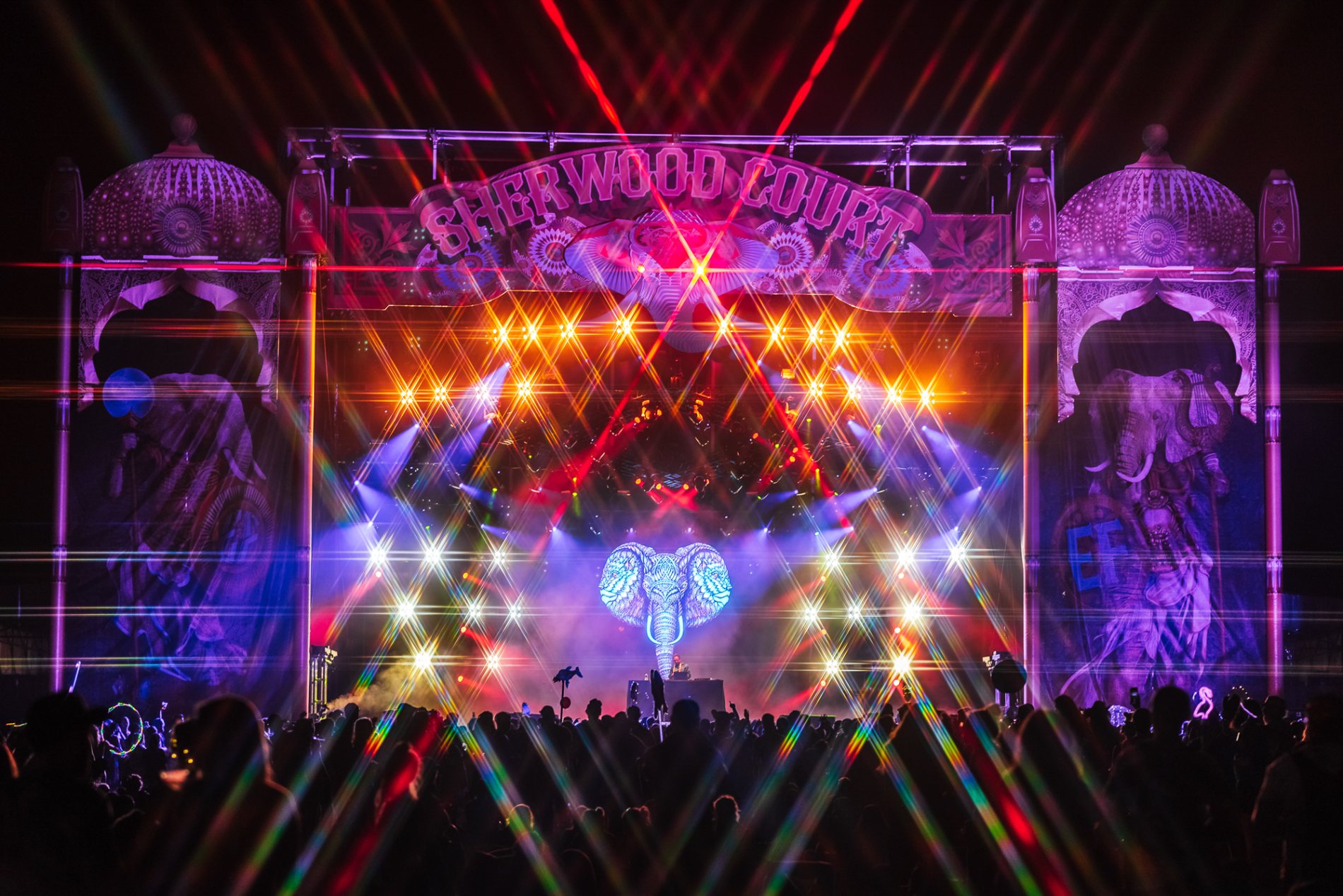 Sherwood Court, an illuminated elephant mapped across the stage in lasers