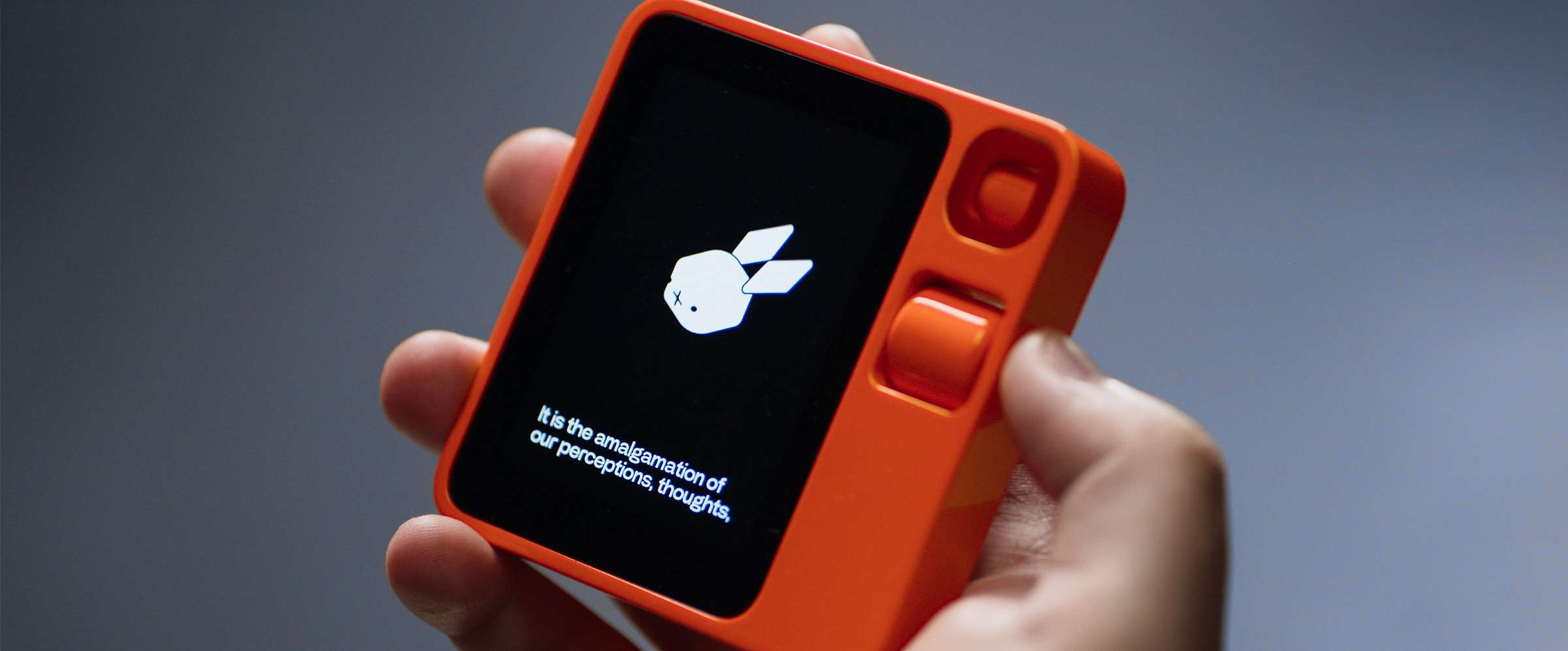 Rabbit r1 device held in hand