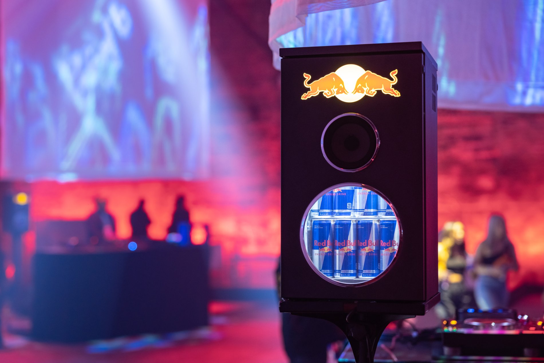 A custom Red Bull dispenser glowing on the floor
