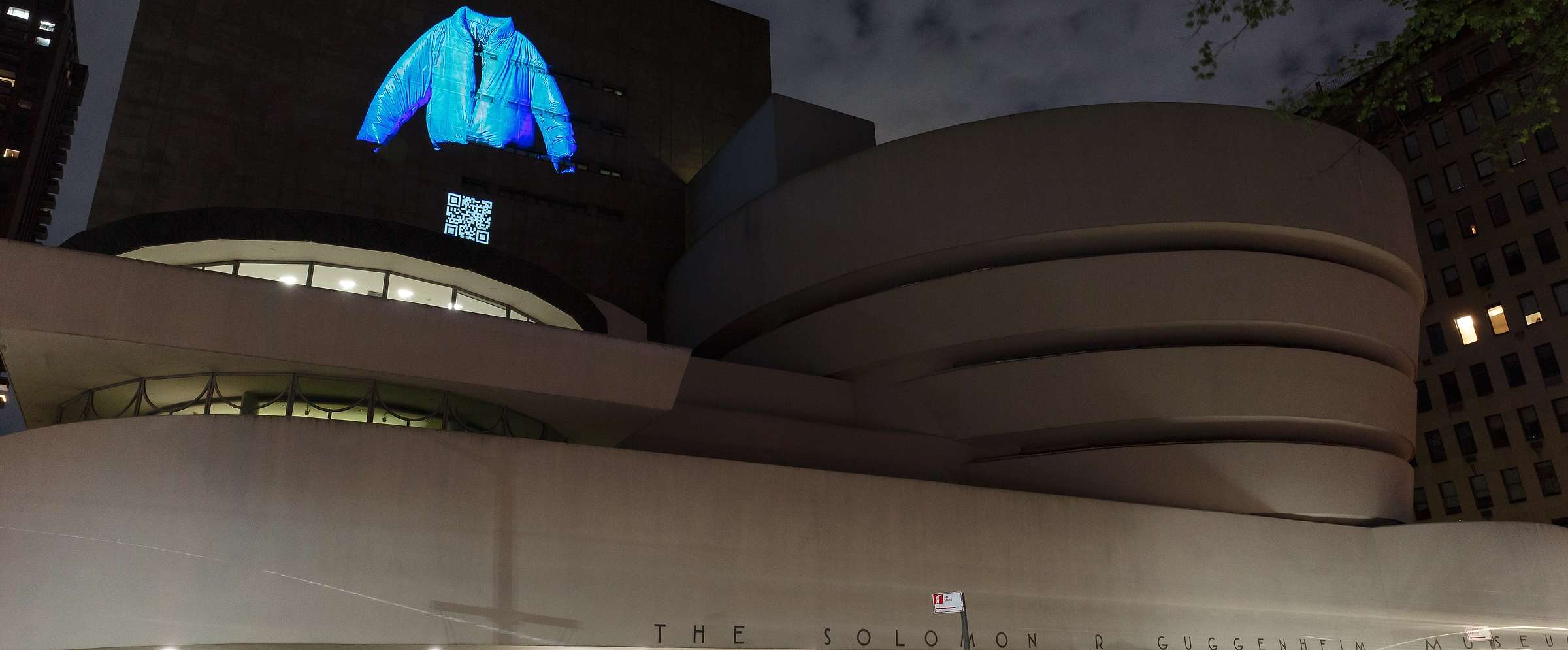 Yeezy Gap, blue jacket projected on the Guggenheim Museum facade