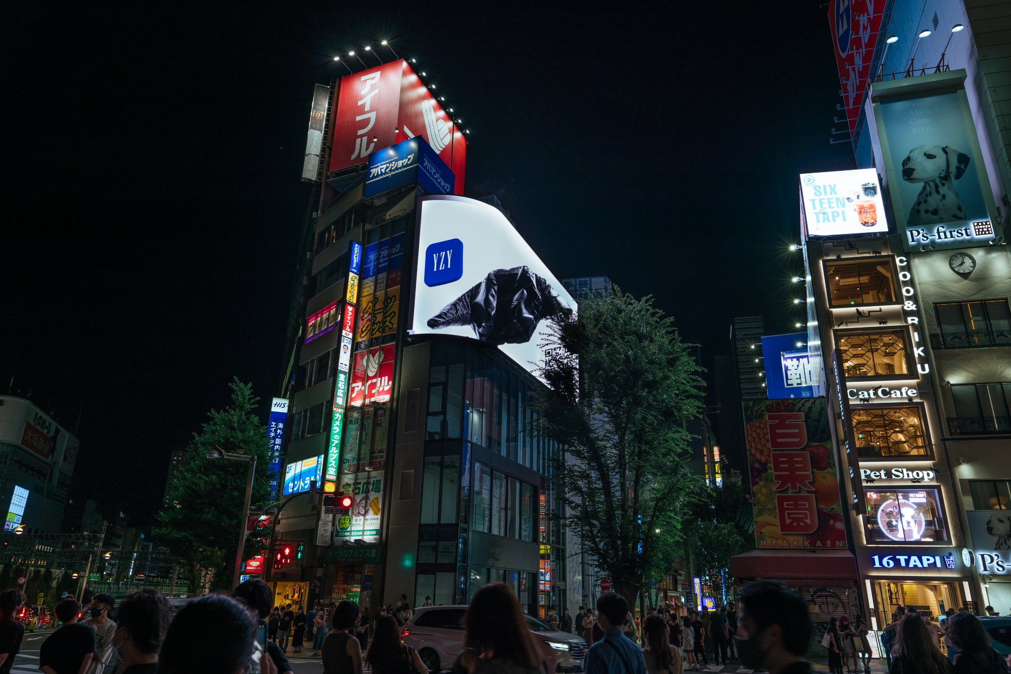 The jacket projected on a tower above a busy crossing at night